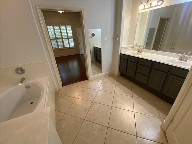 2210 Onion Creek Pkwy Unit 901, Austin, TX 78747 - full bath featuring double vanity, a garden tub, and tile patterned floors