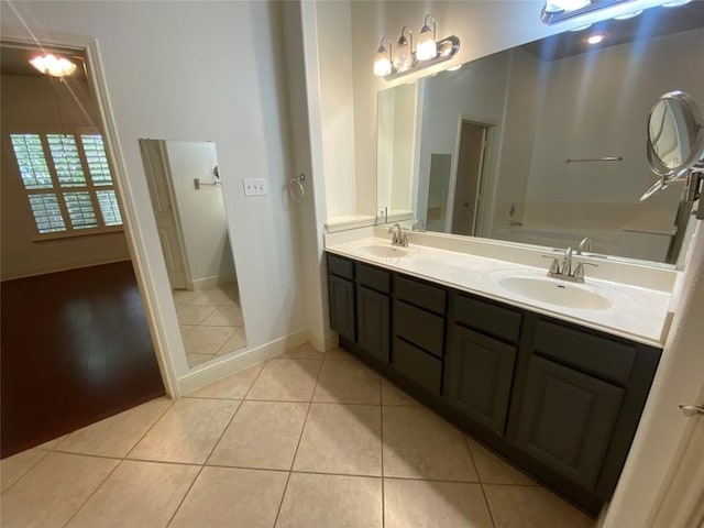 2210 Onion Creek Pkwy Unit 901, Austin, TX 78747 - full bath featuring tile patterned flooring, double vanity, a bath, and baseboards