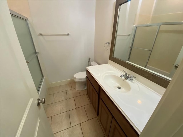 2210 Onion Creek Pkwy Unit 901, Austin, TX 78747 - bathroom with vanity, toilet, tile patterned flooring, and baseboards