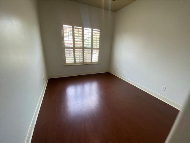 2210 Onion Creek Pkwy Unit 901, Austin, TX 78747 - spare room featuring baseboards and dark wood finished floors