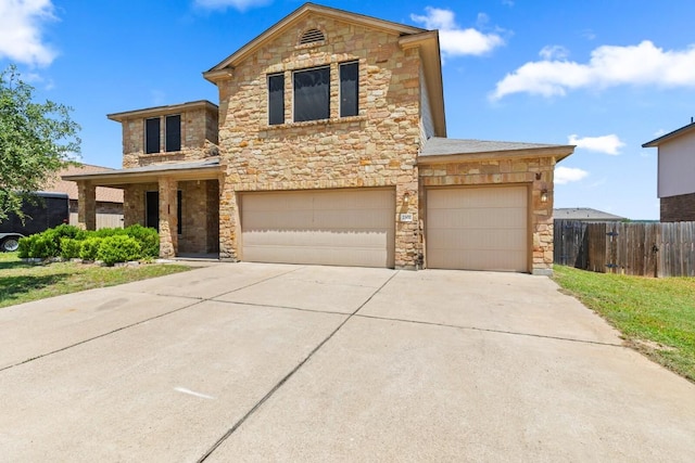 2302 N Ryan Dr, Copperas Cove, TX 76522 - traditional-style home featuring stone siding, concrete driveway, and an attached garage