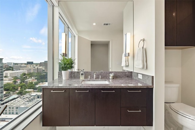 501 W Ave Unit 2303, Austin, TX 78701 - bathroom featuring vanity, toilet, and a view of city