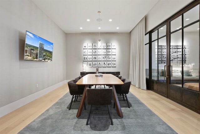 501 W Ave Unit 2303, Austin, TX 78701 - dining space with wood finished floors, recessed lighting, and baseboards