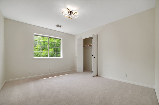 6601 Needham Ln, Austin, TX 78739 - unfurnished bedroom featuring light carpet and a closet