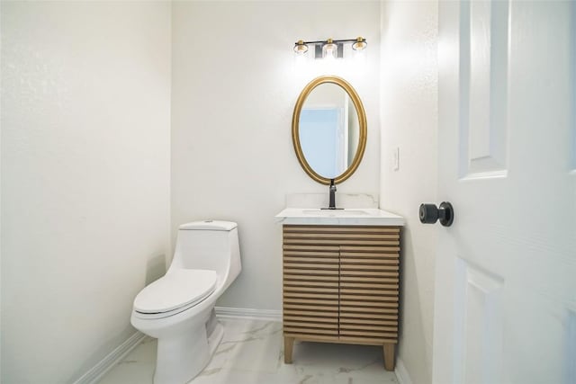 6601 Needham Ln, Austin, TX 78739 - half bath with marble look tiles, vanity, toilet, and baseboards