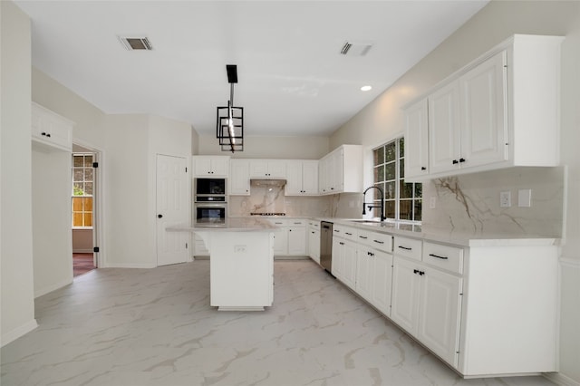 6601 Needham Ln, Austin, TX 78739 - kitchen with stainless steel appliances, plenty of natural light, tasteful backsplash, light countertops, and recessed lighting