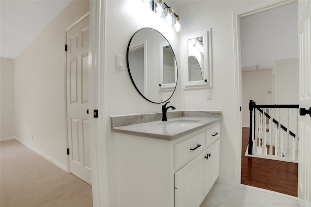 6601 Needham Ln, Austin, TX 78739 - bathroom featuring vanity, baseboards, and marble finish flooring
