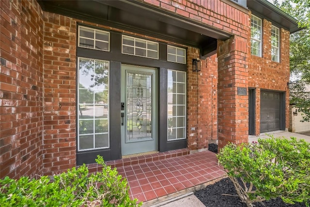6601 Needham Ln, Austin, TX 78739 - entrance to property featuring brick siding, a garage, and concrete driveway