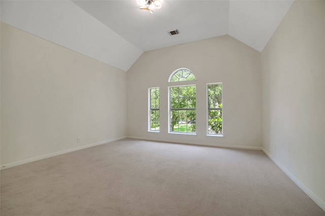 6601 Needham Ln, Austin, TX 78739 - unfurnished room featuring light colored carpet, baseboards, and vaulted ceiling