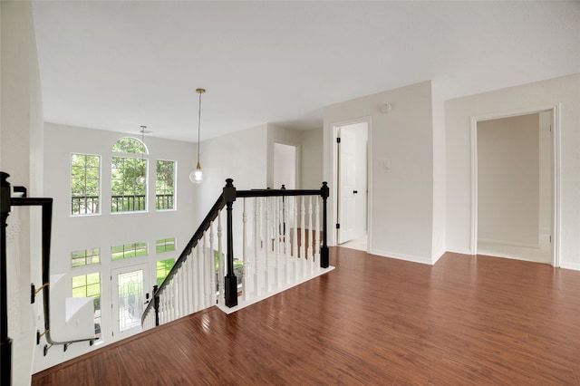 6601 Needham Ln, Austin, TX 78739 - corridor with an upstairs landing, wood finished floors, and baseboards