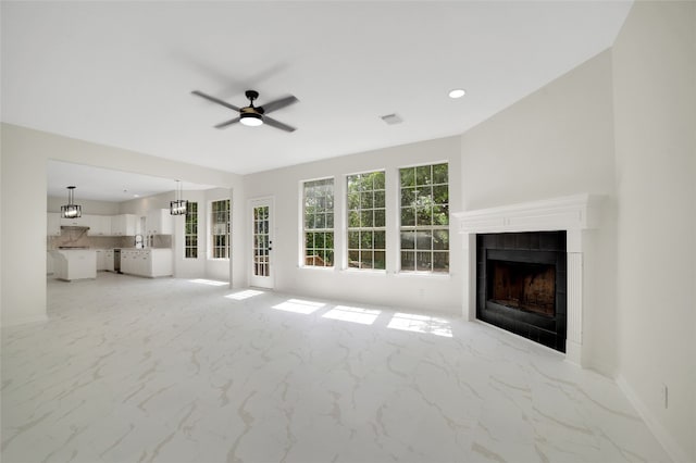 6601 Needham Ln, Austin, TX 78739 - unfurnished living room with ceiling fan, a fireplace, baseboards, and recessed lighting