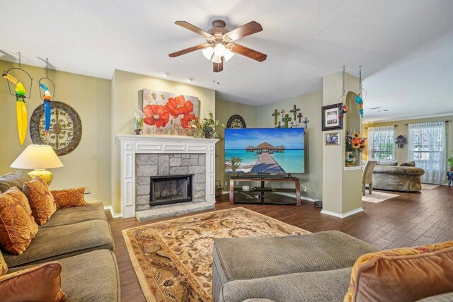 3502 Blackstone Run, San Antonio, TX 78259 - living room with a ceiling fan, wood finished floors, baseboards, and a stone fireplace