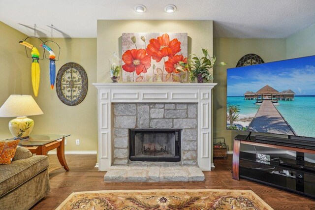 3502 Blackstone Run, San Antonio, TX 78259 - living room with wood finished floors, a fireplace, and baseboards