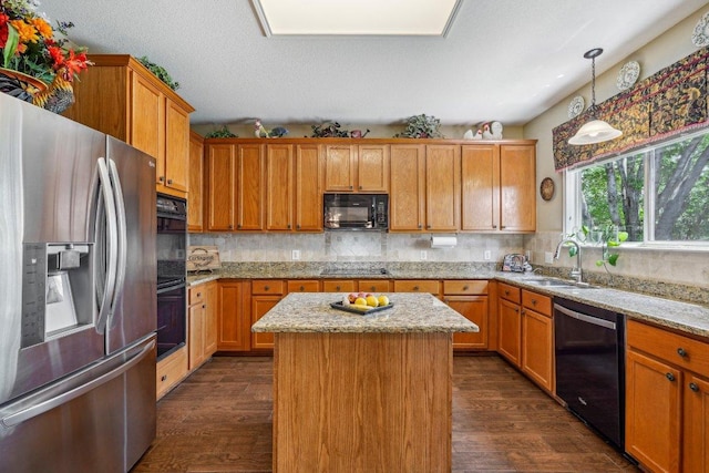 3502 Blackstone Run, San Antonio, TX 78259 - kitchen with black appliances, a sink, dark wood finished floors, and decorative backsplash