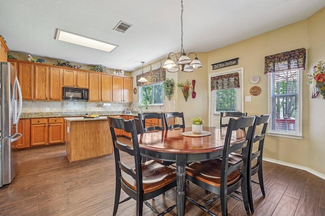 3502 Blackstone Run, San Antonio, TX 78259 - dining area with dark wood-style floors, plenty of natural light, a chandelier, and baseboards