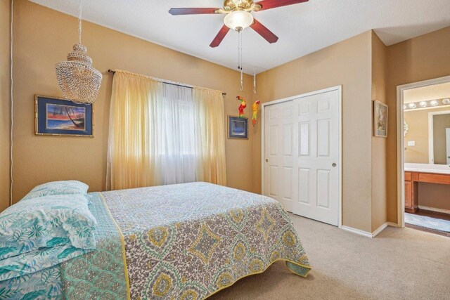 3502 Blackstone Run, San Antonio, TX 78259 - bedroom featuring carpet floors, a closet, a ceiling fan, baseboards, and a chandelier