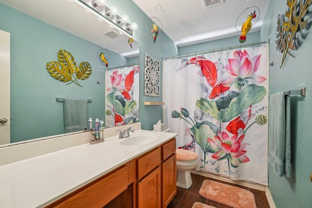 3502 Blackstone Run, San Antonio, TX 78259 - full bathroom featuring vanity, toilet, wood finished floors, and curtained shower
