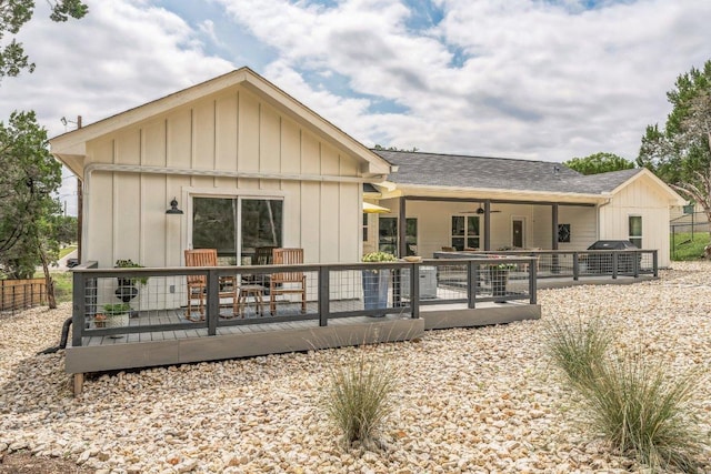 1174 Desiree St, Canyon Lake, TX 78133 - back of house featuring a deck, ceiling fan, board and batten siding, and a shingled roof