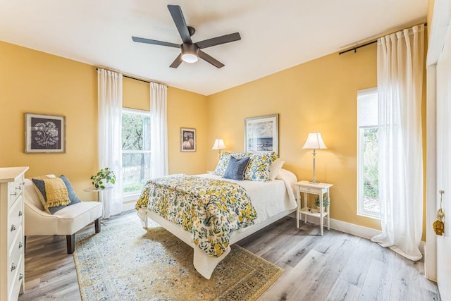 1174 Desiree St, Canyon Lake, TX 78133 - bedroom with light wood finished floors and ceiling fan