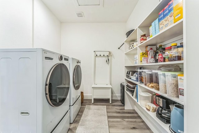 1174 Desiree St, Canyon Lake, TX 78133 - washroom with washer and clothes dryer and wood finished floors