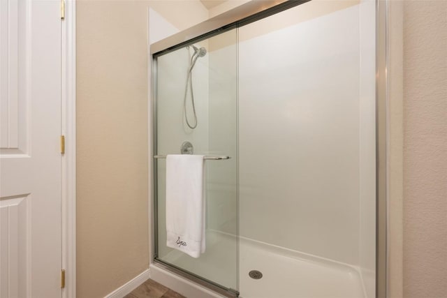 605 Silver Wing Dr, Austin, TX 78725 - full bathroom with a stall shower and baseboards