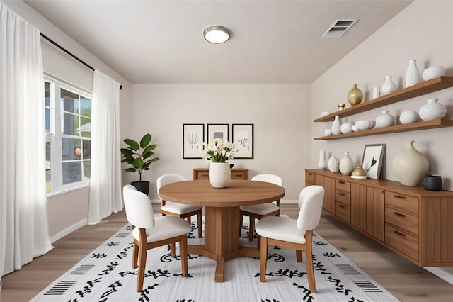 605 Silver Wing Dr, Austin, TX 78725 - dining area featuring light wood-style floors and baseboards