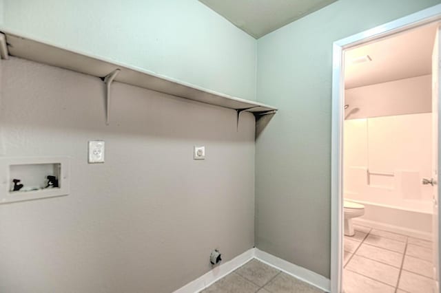 201 Clore Rd, Harker Heights, TX 76548 - laundry room with washer hookup, electric dryer hookup, and light tile patterned floors