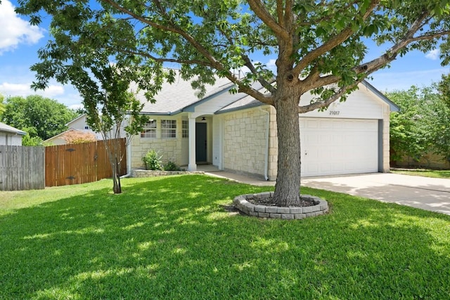 21017 Secretariat Ridge Ln, Pflugerville, TX 78660 - ranch-style home featuring concrete driveway, an attached garage, and stone siding