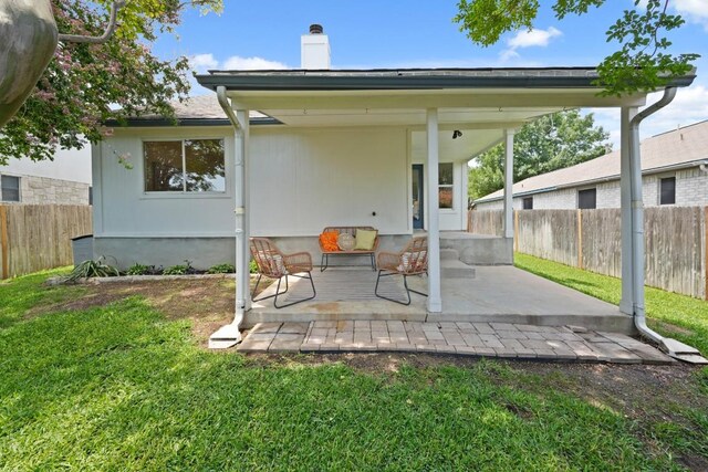 21017 Secretariat Ridge Ln, Pflugerville, TX 78660 - back of property with a chimney and a patio area