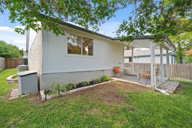 21017 Secretariat Ridge Ln, Pflugerville, TX 78660 - back of property with a patio and central air condition unit