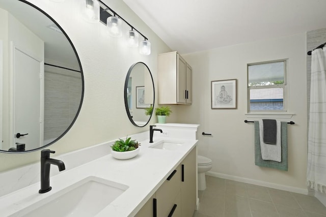 21017 Secretariat Ridge Ln, Pflugerville, TX 78660 - bathroom with double vanity, tile patterned floors, toilet, baseboards, and curtained shower