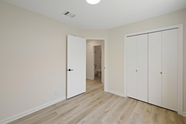 21017 Secretariat Ridge Ln, Pflugerville, TX 78660 - unfurnished bedroom with light wood-type flooring, baseboards, and a closet