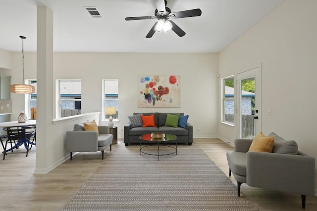 21017 Secretariat Ridge Ln, Pflugerville, TX 78660 - living area featuring light wood finished floors, baseboards, and a ceiling fan