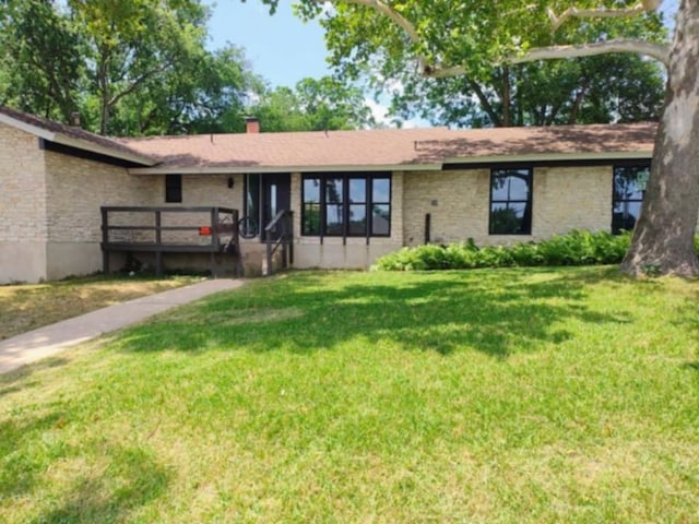 2101 Vanderbilt Ln, Austin, TX 78723 - single story home featuring a front yard and brick siding