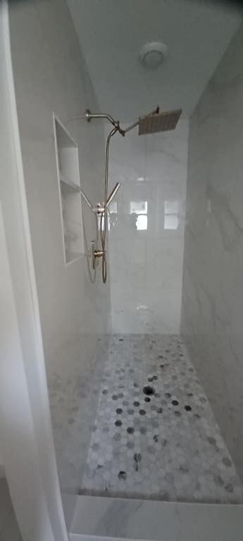 2101 Vanderbilt Ln, Austin, TX 78723 - full bath with a tile shower