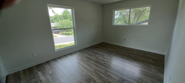 2101 Vanderbilt Ln, Austin, TX 78723 - unfurnished room featuring dark wood-style floors and baseboards