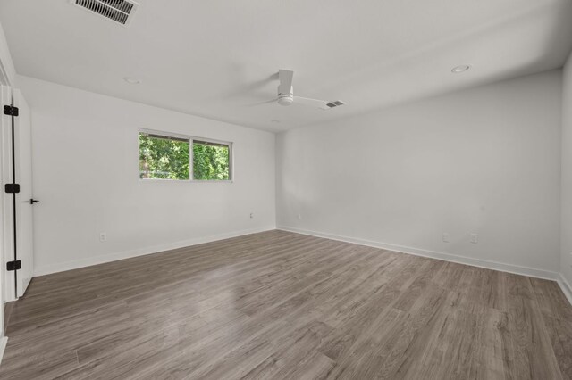 2101 Vanderbilt Ln, Austin, TX 78723 - unfurnished room with a ceiling fan and wood finished floors