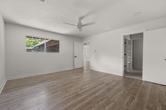 2101 Vanderbilt Ln, Austin, TX 78723 - spare room featuring wood finished floors and ceiling fan