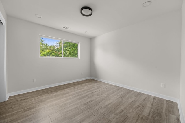 2101 Vanderbilt Ln, Austin, TX 78723 - spare room with wood finished floors
