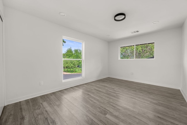 2101 Vanderbilt Ln, Austin, TX 78723 - unfurnished room featuring wood finished floors and baseboards