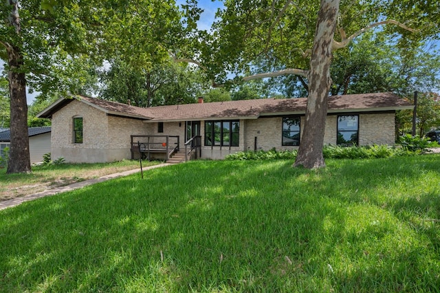 2101 Vanderbilt Ln, Austin, TX 78723 - view of front of property featuring a front lawn and brick siding