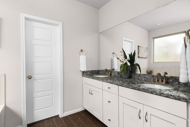 299 Diamond Point Dr, Dripping Springs, TX 78620 - full bath with double vanity and wood finished floors
