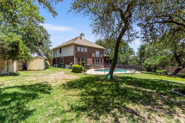 9501 Aire Libre Dr, Austin, TX 78726 - back of house featuring brick siding, a chimney, and cooling unit