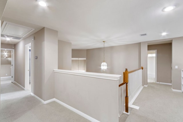9501 Aire Libre Dr, Austin, TX 78726 - hallway featuring attic access, an upstairs landing, carpet flooring, baseboards, and recessed lighting