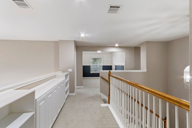 9501 Aire Libre Dr, Austin, TX 78726 - corridor with light colored carpet, an upstairs landing, baseboards, and recessed lighting