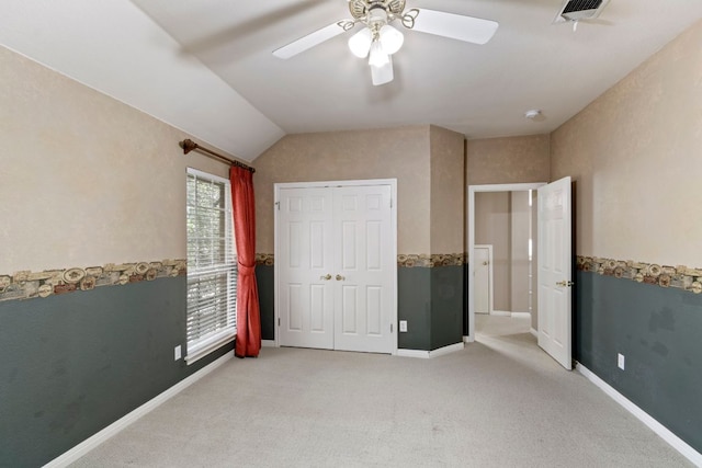9501 Aire Libre Dr, Austin, TX 78726 - unfurnished bedroom with light carpet, lofted ceiling, ceiling fan, and baseboards