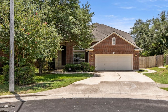 9501 Aire Libre Dr, Austin, TX 78726 - view of front of house featuring a garage, driveway, brick siding, and a shingled roof