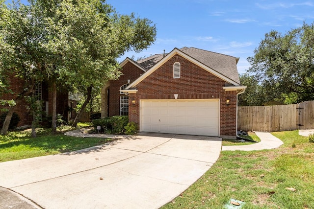 9501 Aire Libre Dr, Austin, TX 78726 - traditional home with a garage, concrete driveway, brick siding, and roof with shingles
