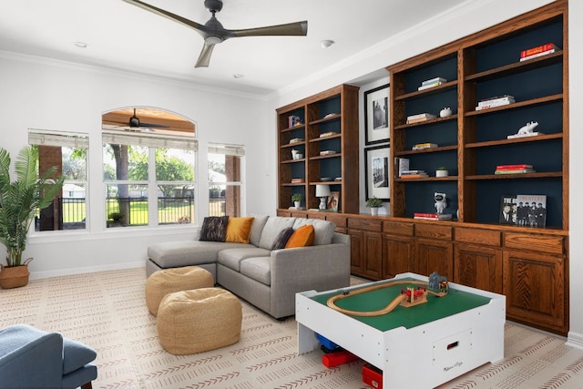 10833 Olympia Fields Loop, Austin, TX 78747 - living room with a ceiling fan, ornamental molding, baseboards, and light colored carpet