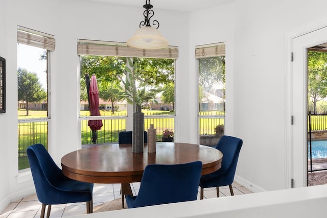 10833 Olympia Fields Loop, Austin, TX 78747 - dining area with light tile patterned floors and baseboards